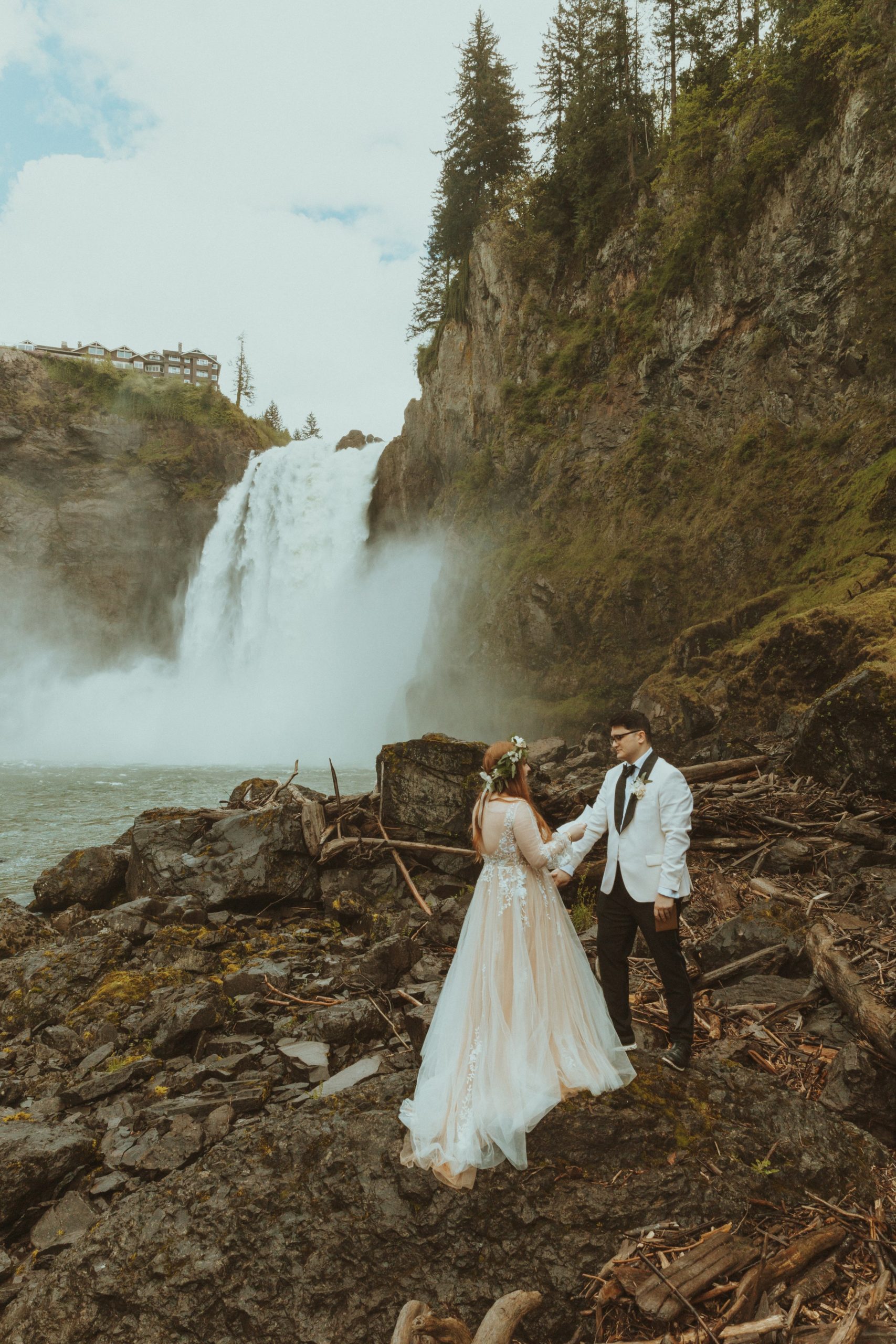 Bride and Groom Read Vows in front of Snoqualmie Falls