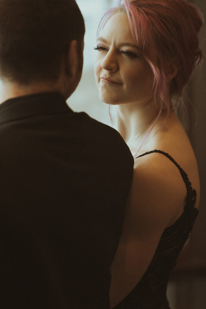 bride and groom looking at each other 