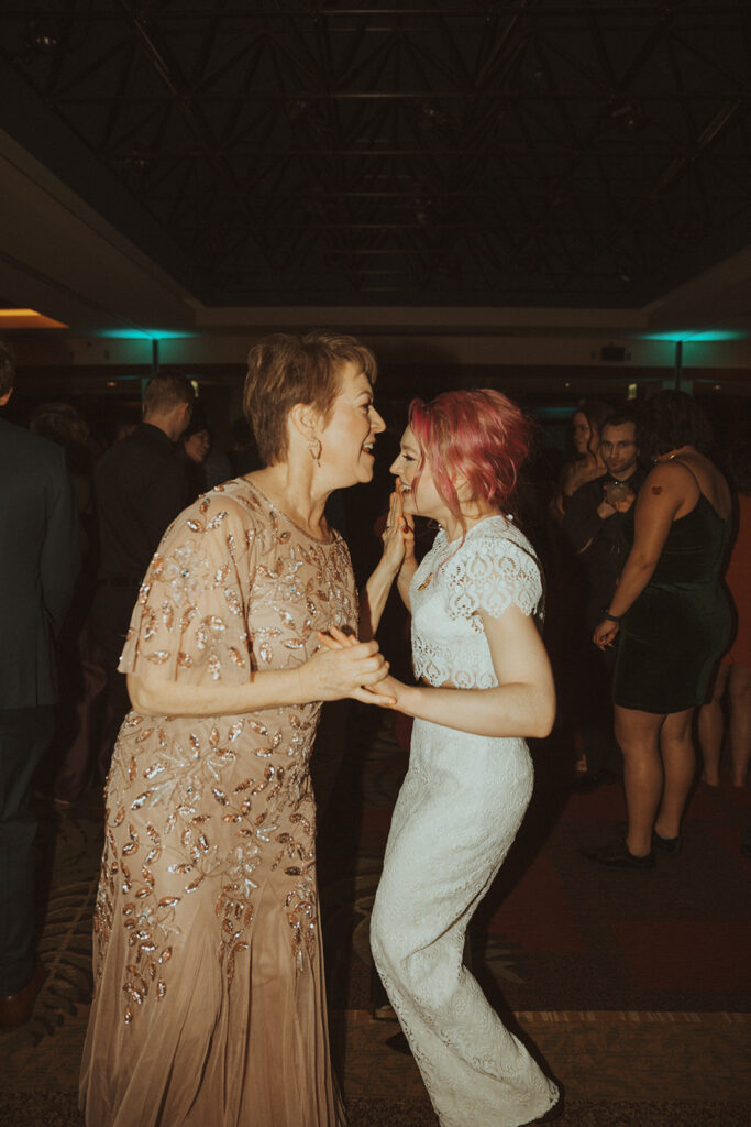 bride and her mom dancing