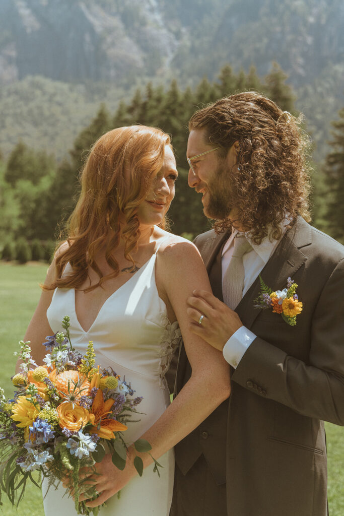 golden hour picture of the bride and groom looking at each other 