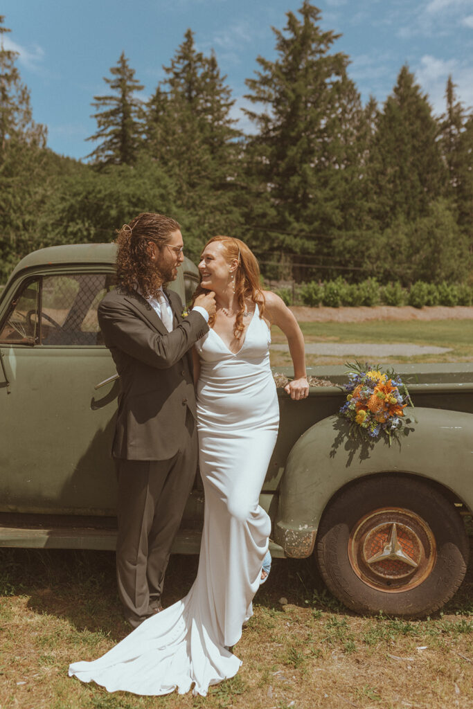 bride and groom smiling at each other 