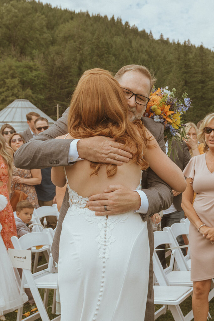 bride and her dad hugging