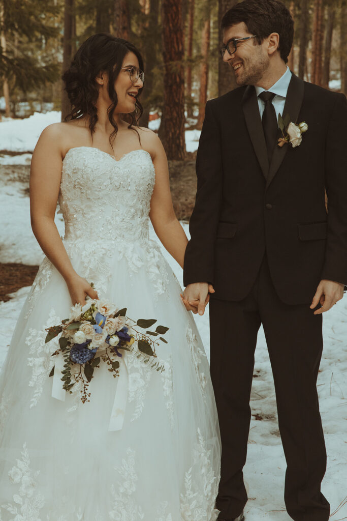 couple holding hands at their adventurous elopement 