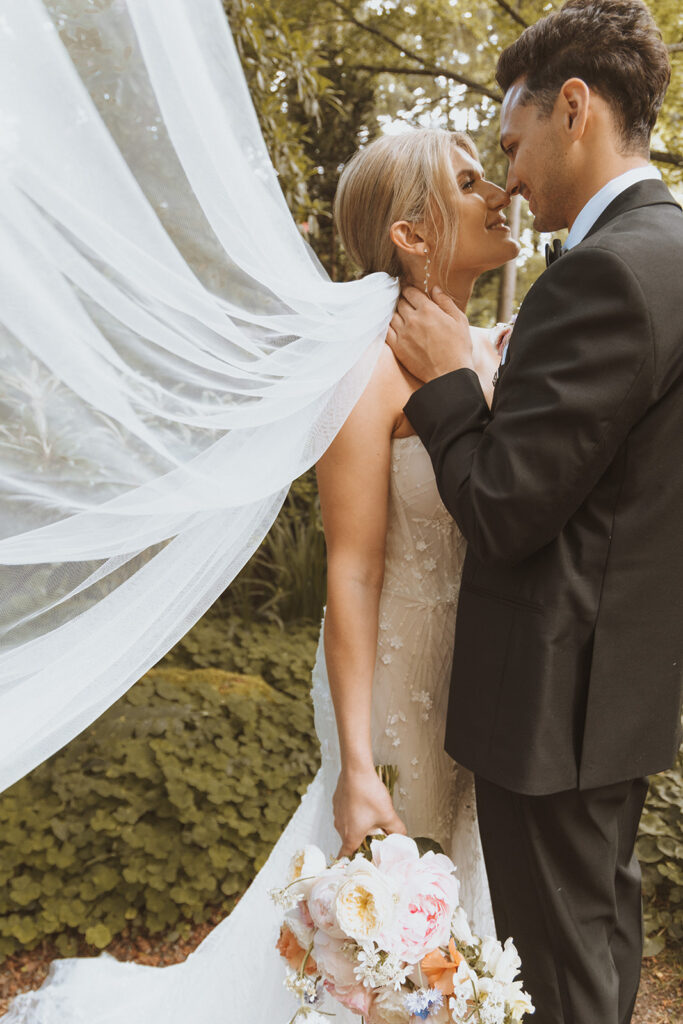 bride and groom looking at each other 