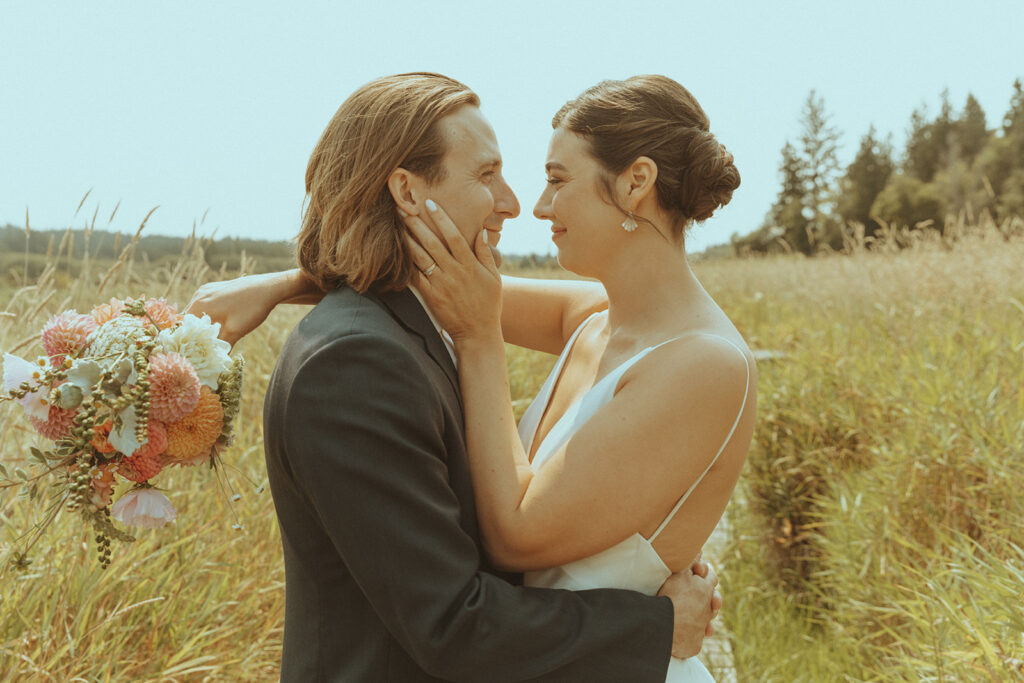 bride and groom looking at each other 