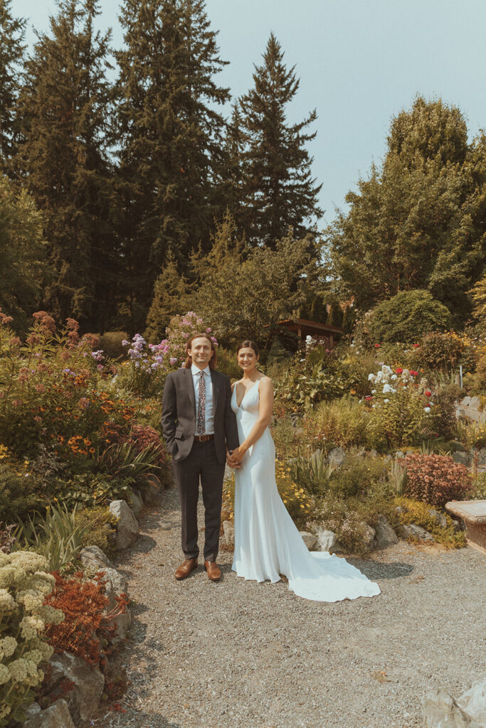 bride and groom looking at the camera during their bridal portraits