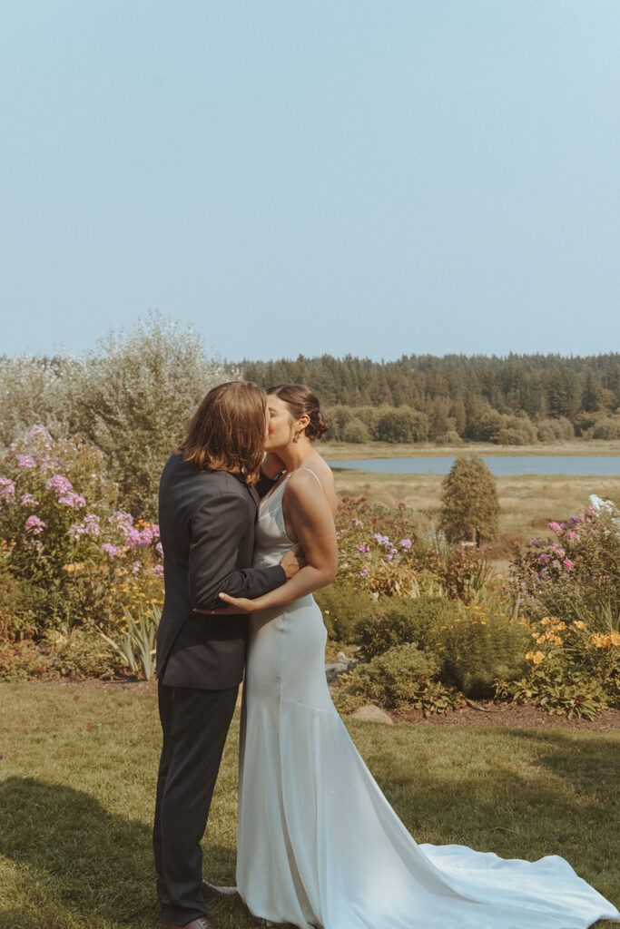 bride and groom kissing after their wedding ceremony 