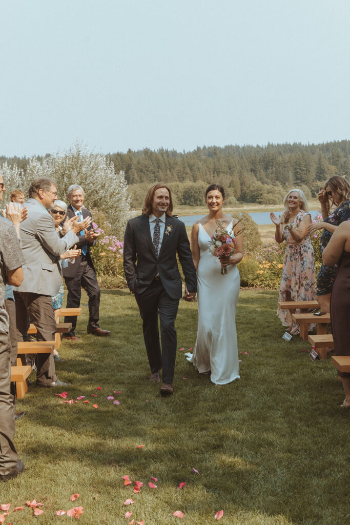 bride and groom heading to their wedding reception