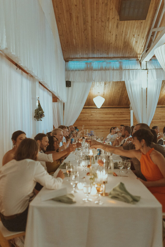 guests at the wedding reception drinking champagne  