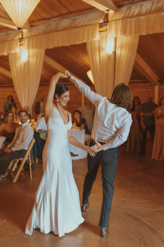 newlyweds dancing at their boho wedding reception