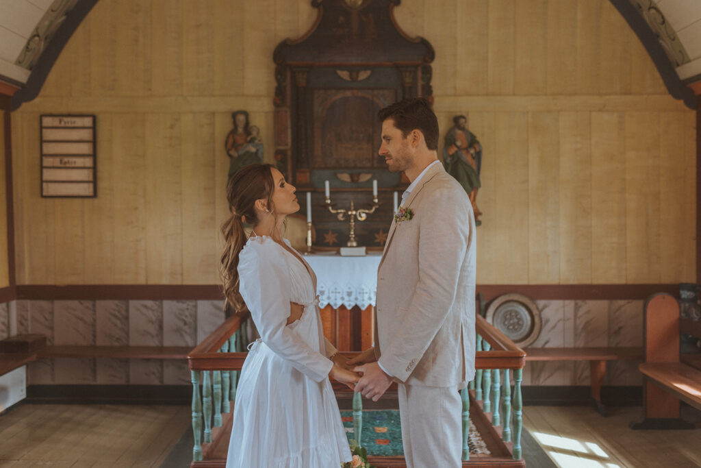 bride and groom holding hands at their ceremony