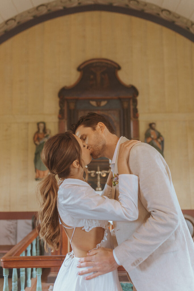 bride and groom kissing after their elopement ceremony 