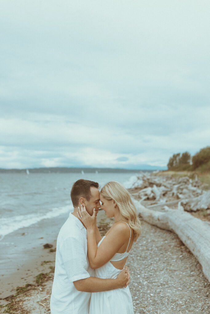 couple smiling at each other at their engagement session