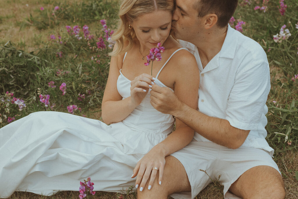 fiance kissing his fiance on the cheek