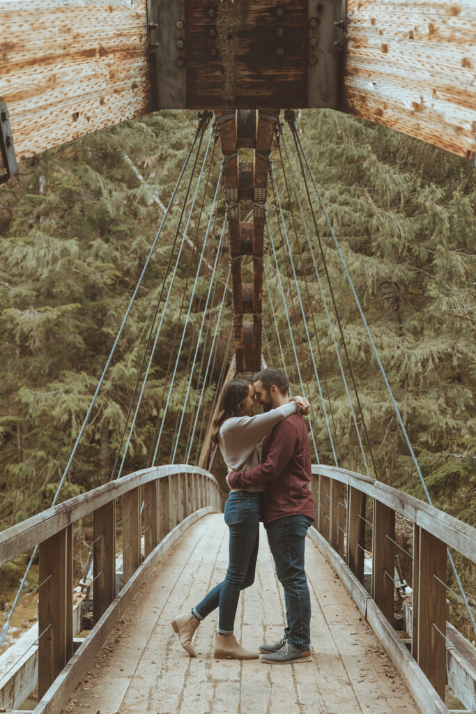 newly engaged couple kissing during their photoshoot