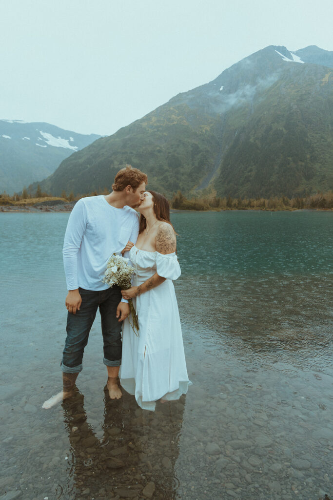 couple kissing at their whimsical engagement session