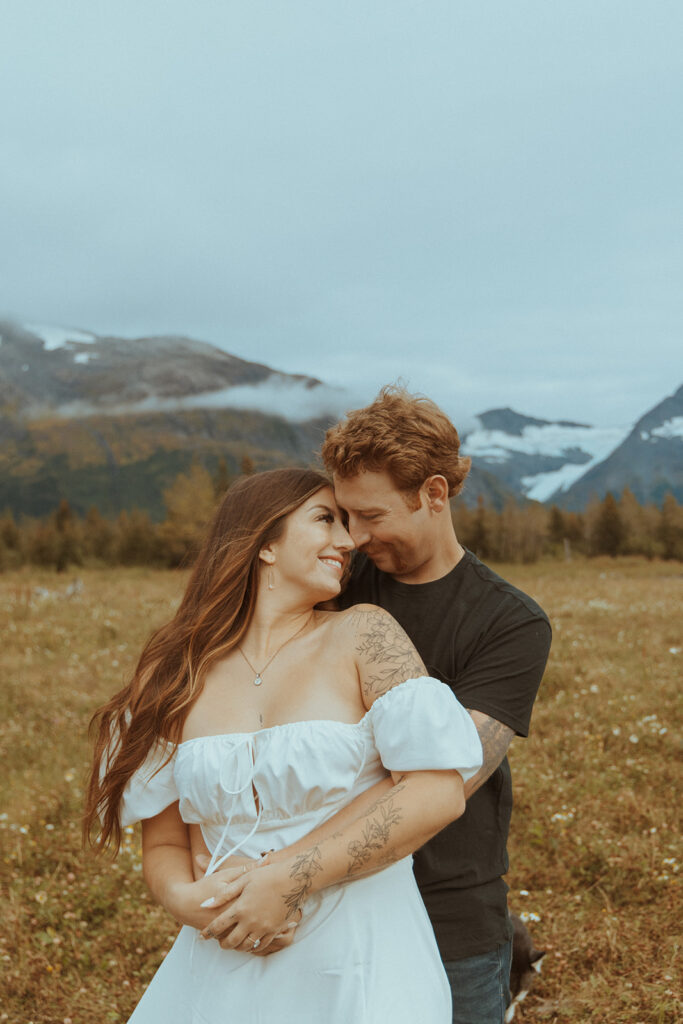 couple looking at each other during their whimsical engagement session 