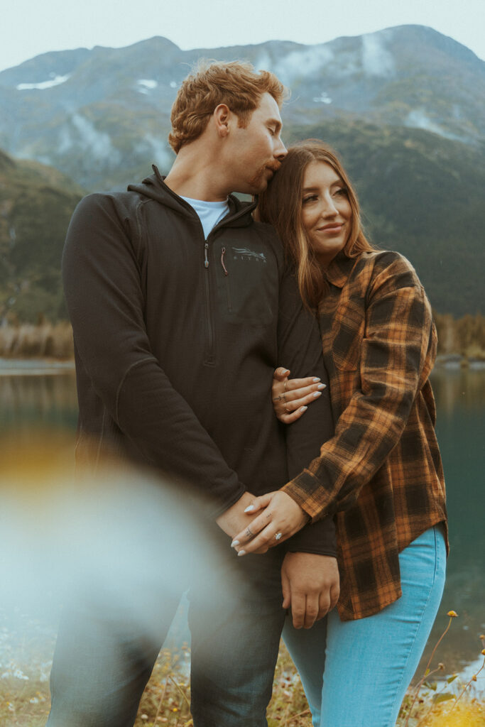 couple hugging during their adventurous engagement phootshoot