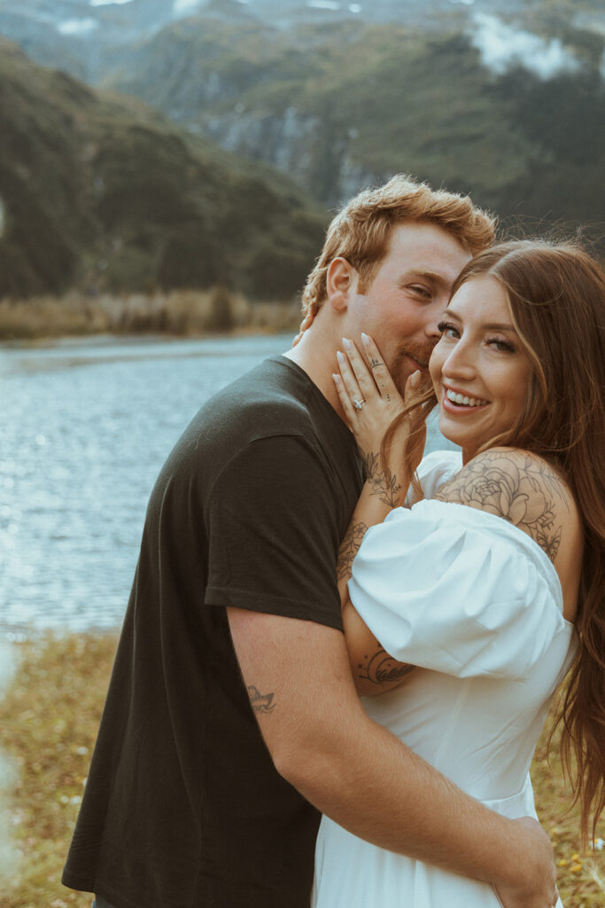 fiance kissing his fiance on the cheek 