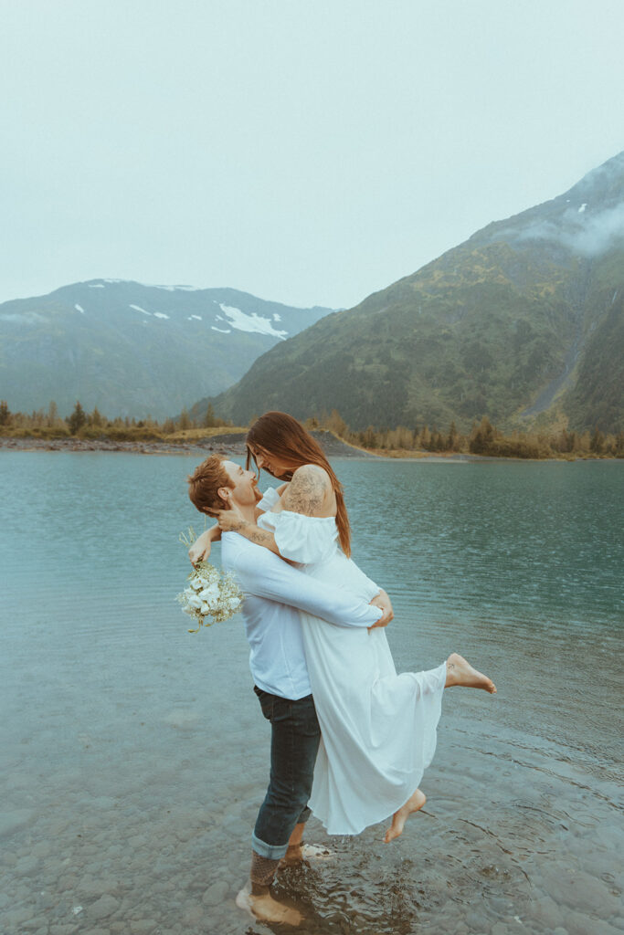 couple at their playful alaskan engagement session