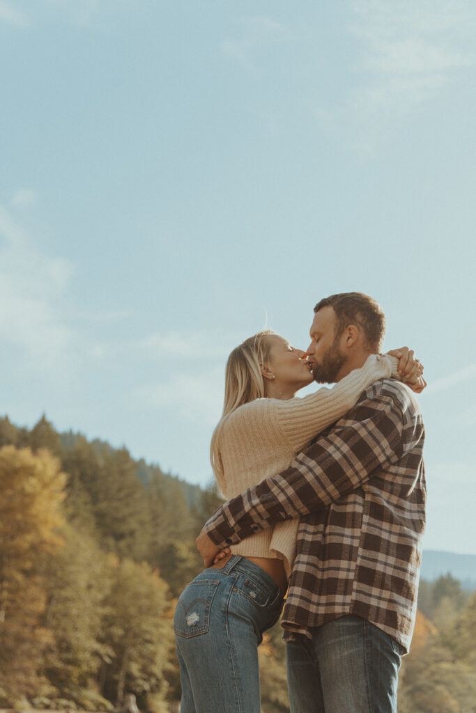 cute couple kissing during their photoshoot - locations for your engagement photos