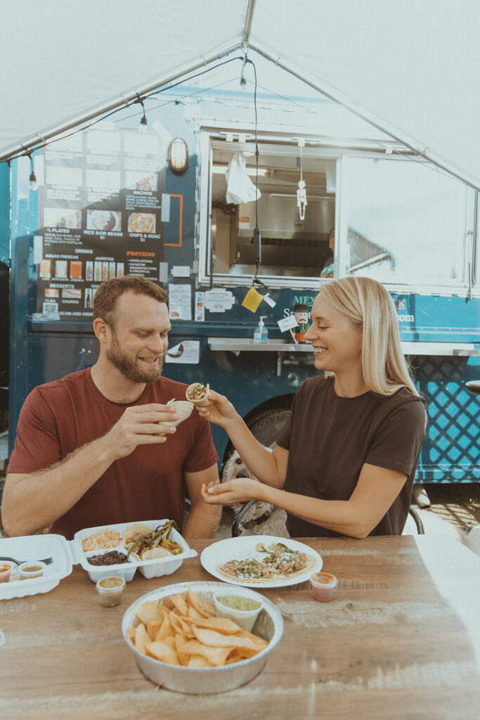 couple eating before their engagement session