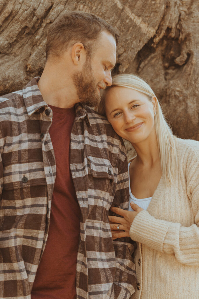 fiance kissing his fiance on the head 