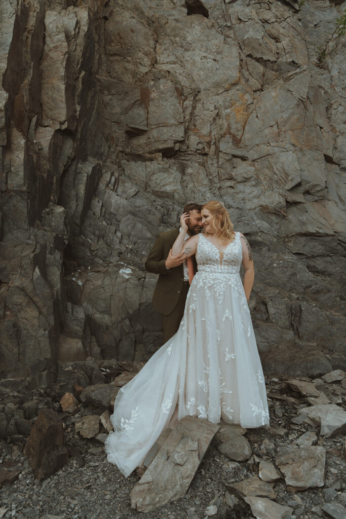 cute couple hugging during their bridal portraits 