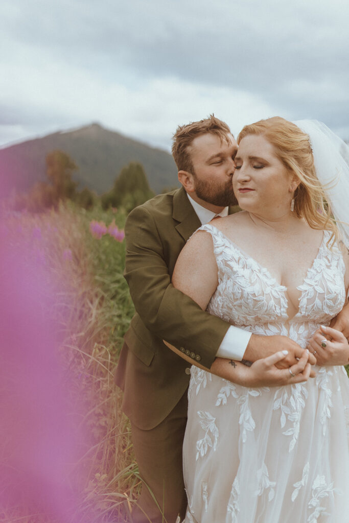 picture of the groom hugging the bride