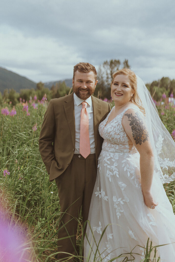 bride and groom looking at the camera at creekbend cafe in alaska