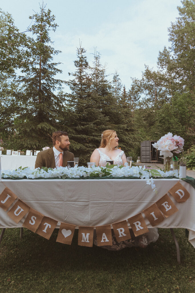 bride and groom at their reception at creekbend cafe in alaska