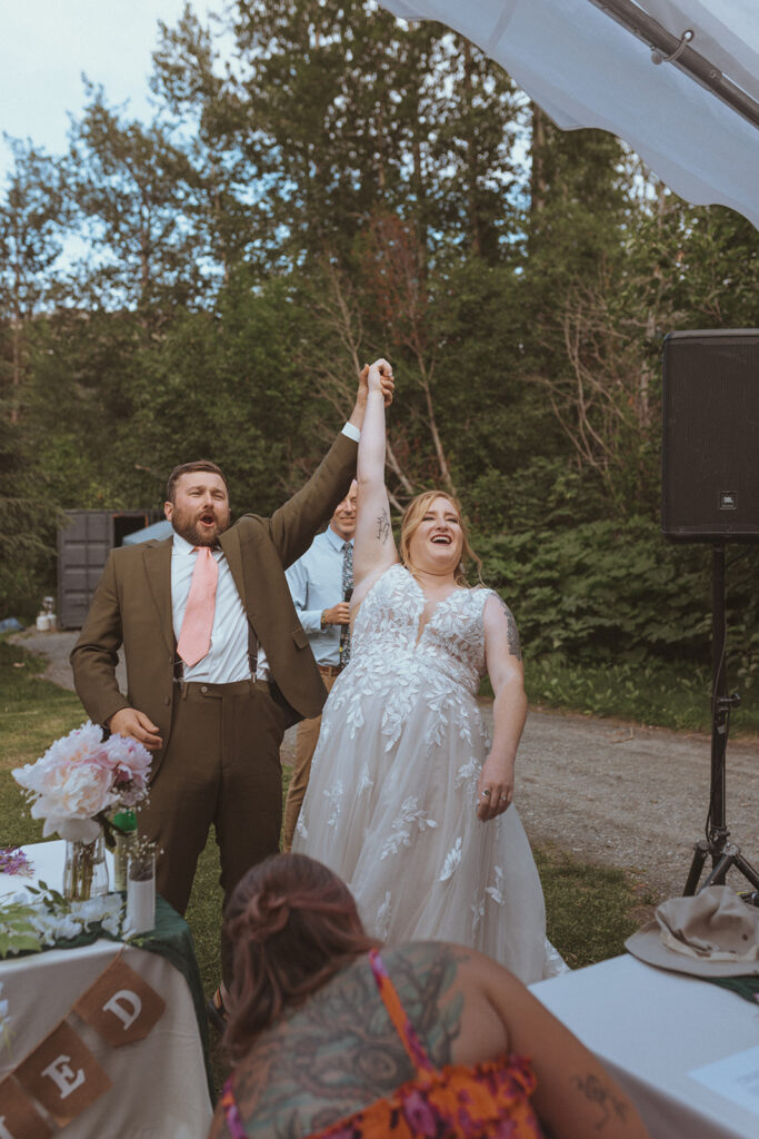 happy newly married couple at creekbend cafe in alaska