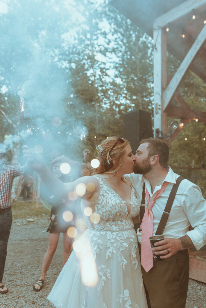 newly married couple kissing at creekbend cafe