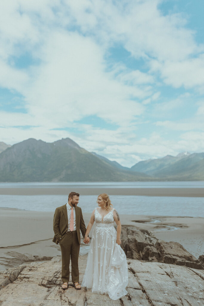 picture of the bride and groom holding hands