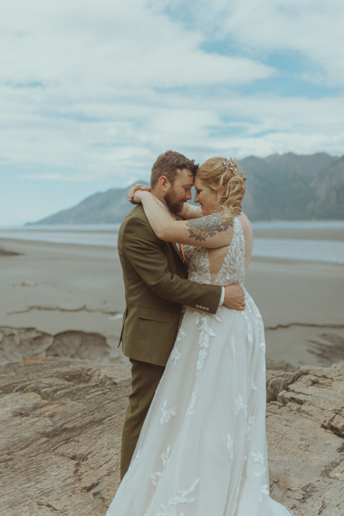 cute couple hugging before their romantic wedding ceremony 