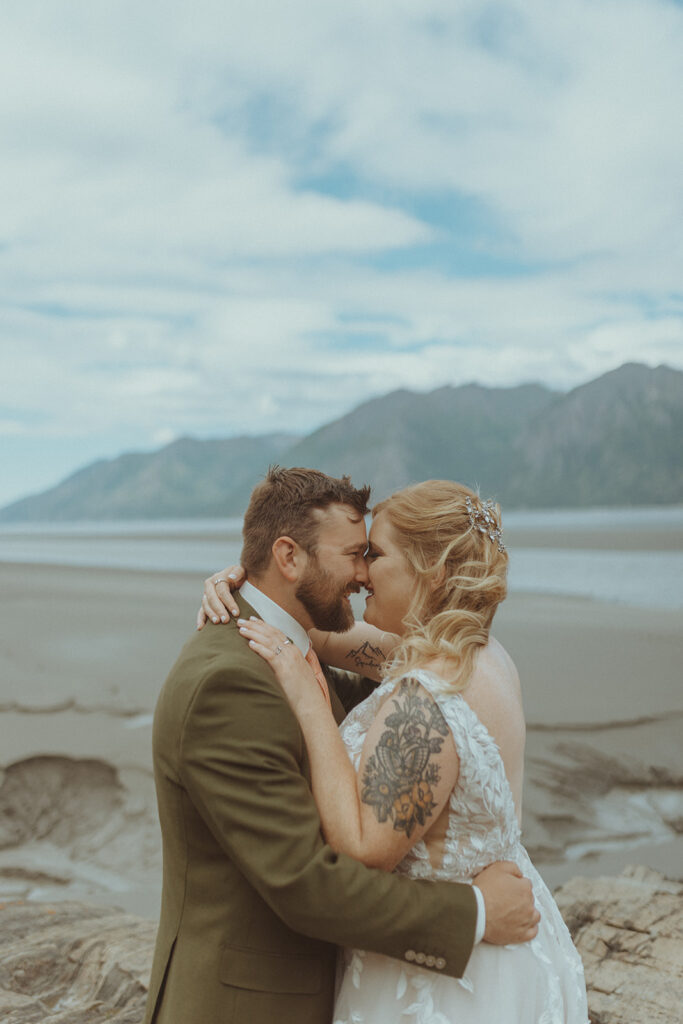 bride and groom laughing with each other 