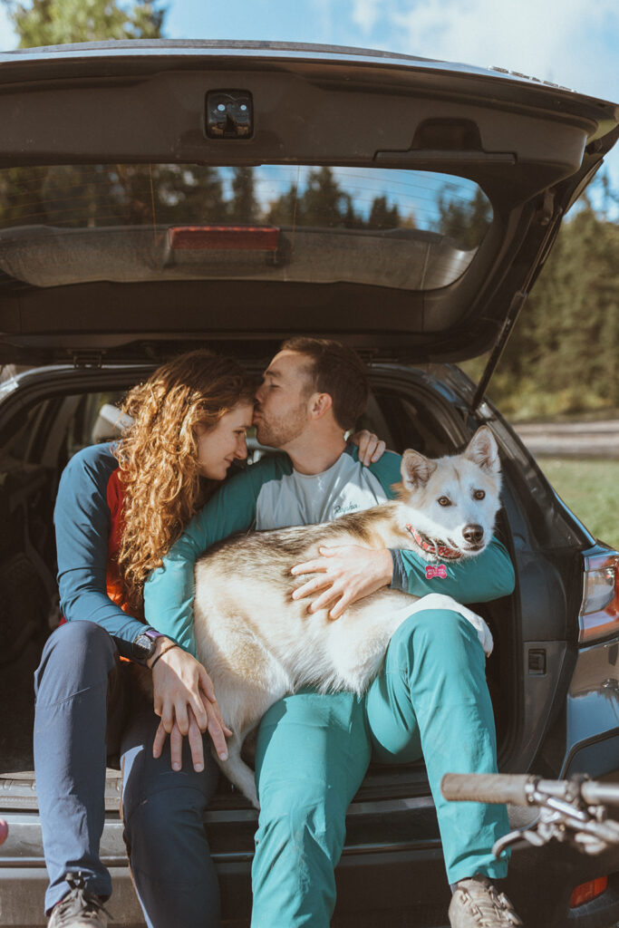 cute picture of the newly engaged couple with their rescue pup