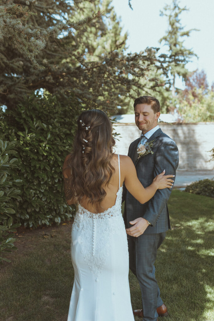 groom emotional seeing the bride in her wedding dress