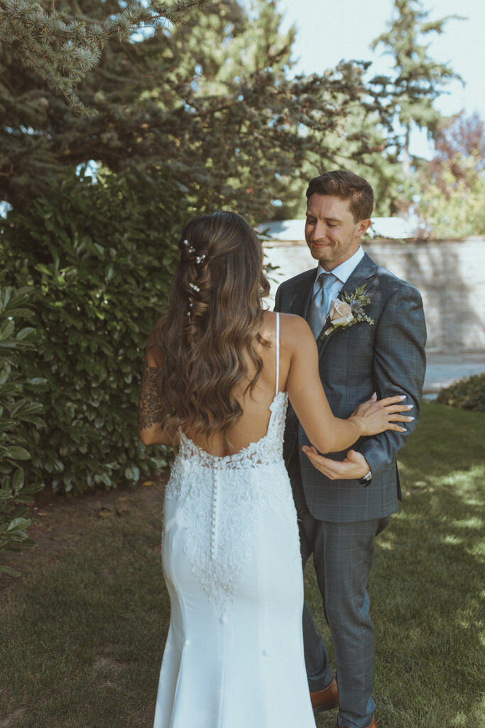 bride and groom hugging during their first loook