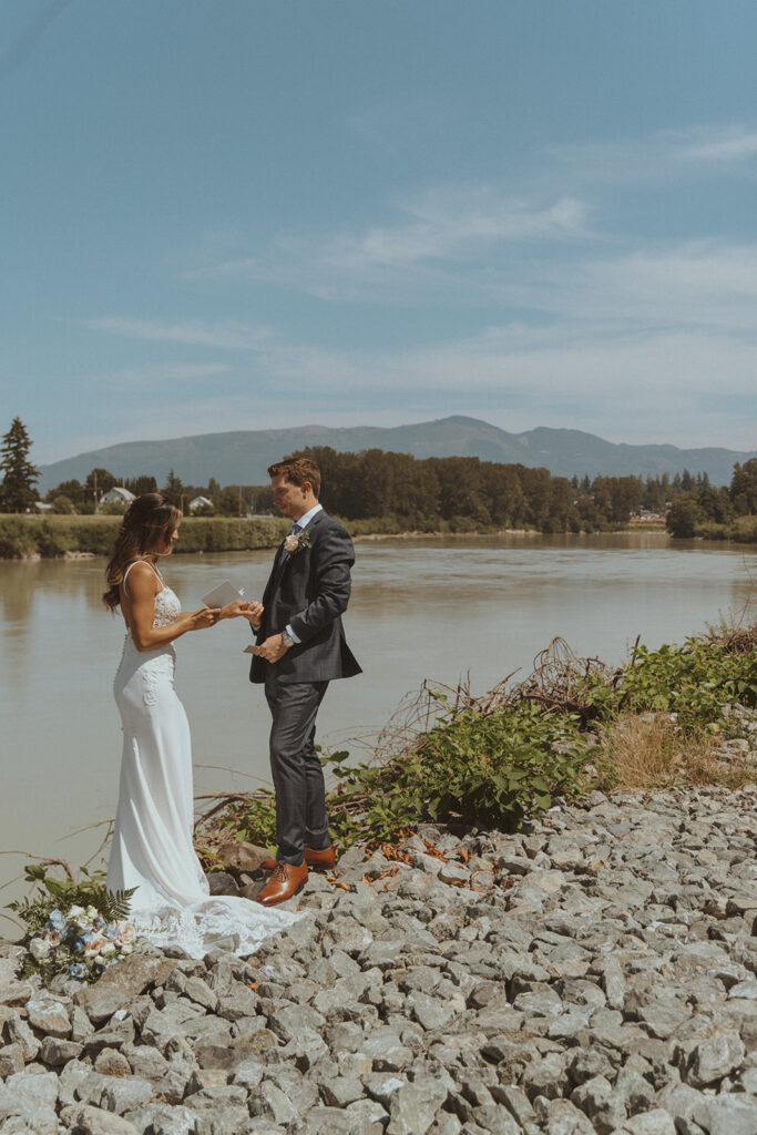 bride and groom reading their vows 