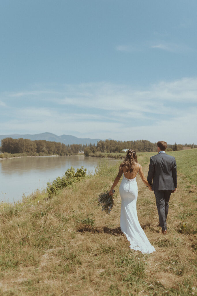 cute couple walking around their wedding venue 