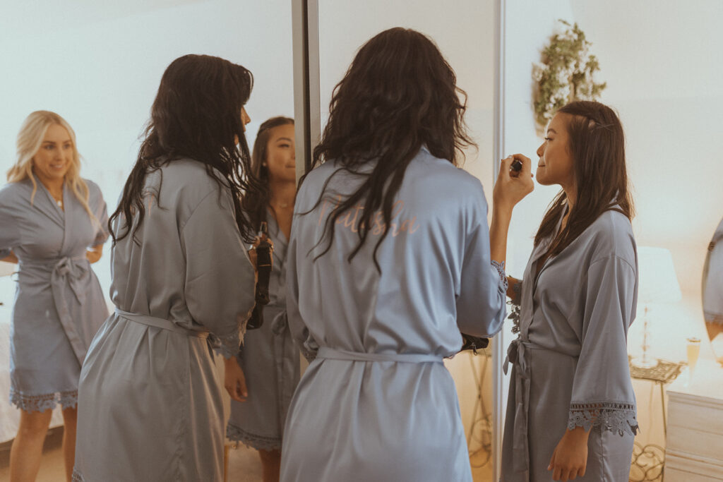 bridesmaids getting ready for the ceremony 