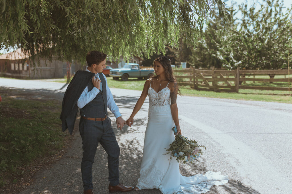 cute couple holding hands during their bridal portraits 