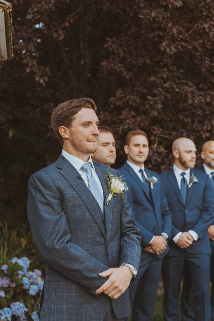 cute picture of the groom emotional seeing the bride walk down the aisle 