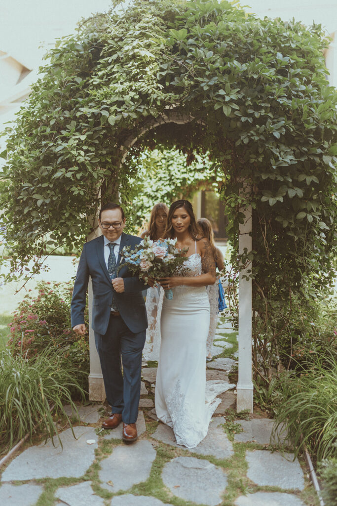 cute picture of the bride walking down the aisle 