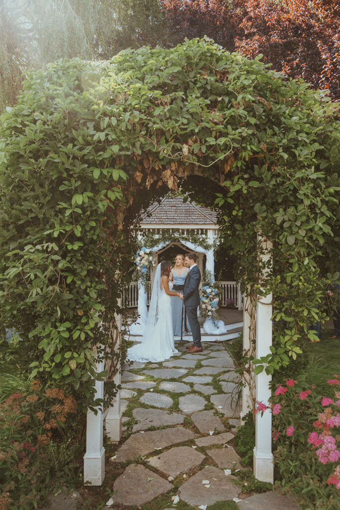 bride and groom holding hands at their wedding ceremony