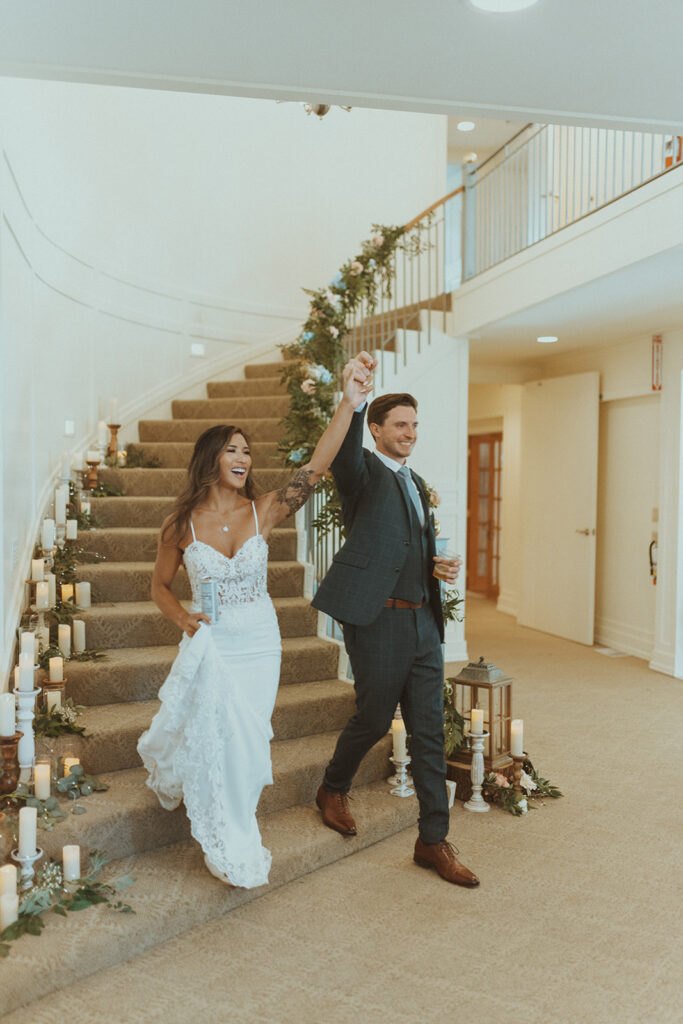 cute couple entering their stunning reception