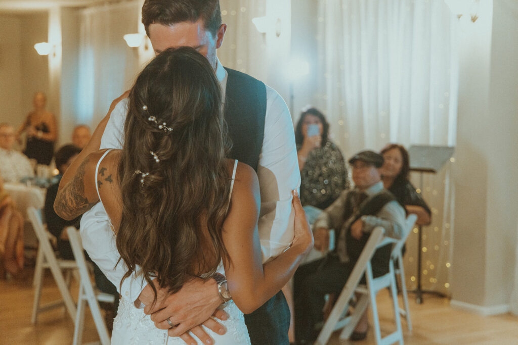 newlyweds kissing after their first dance