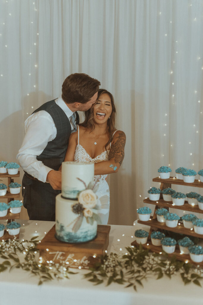 newlyweds cutting their wedding cake 