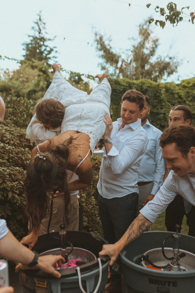 newlyweds having fun at their wedding reception